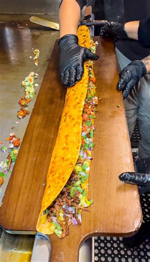 🔥 Think you’ve got what it takes to conquer The 40-Inch Machete? 🔥 Denver’s wildest food challenge has arrived — a massive 40-inch machete platter loaded with enough flavor (and calories) to make your jaw drop. Few have dared… even fewer have finished. Tag your crew, bring your appetite, and prove you’re not afraid of a little blade-to-plate action. 💪🍖⚔️ 📍 Denver, CO — Are YOU the next legend? #machetechallenge #foodchallenge #reels #taco | Machetes Gourmet