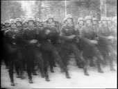 Montage of German soldiers goose stepping, German POWs marching,...