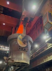 Today we have another video from our #Scunthorpe Concast (Continuous Casting) plant. This shows the beginning of the process and we can see the crane lifting the ladle from BOS Plant and placing it on the Slab Caster ladle car. The ladle will hold 300 tonnes of molten steel so including the weight of the ladle the crane is lifting an impressive 450 tonnes. Once the ladle is in place on the ladle car, it moves on tracks into position over the tundish so the steel can be teemed – ladle to tundish 