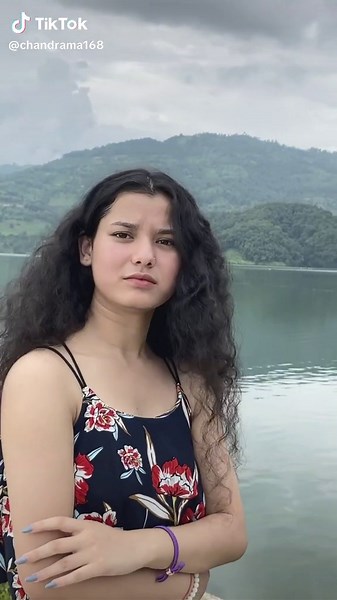 Young Woman Enjoys Nature by Serene Lake