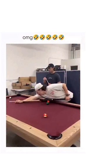 what if on Instagram: "The post shares a 21-second video of two friends engaging in a lively pool game on red-felt tables in a warehouse-like setting, featuring dynamic shots and playful banter that capture casual camaraderie.it quickly garnered 73,000 views and 430 likes, driven by the relatable humor of exaggerated pool tricks and near-misses. Viewer replies in Indonesian emphasize the players’ skill (“jago”) and lighthearted “cheating” moments (“curang”), underscoring the video’s appeal as en