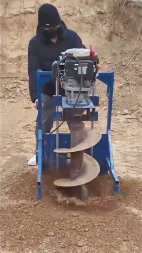 drilling a deep hole in the brown dry soil using a large blue machine #shorts