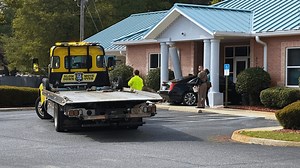 Pedestrian seriously injured after car crashes into Escambia County credit union