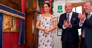 Meghan Markle Jokes That She's Feeling 'Very Pregnant' as She Cradles Baby Bump During Outing