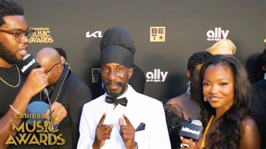 49K views · 2.5K reactions | Sizzla caught up with ‘Love Island USA's’ Chelley Bissainthe & Billboard’s Kyle Denis on the red carpet at the Caribbean Music Awards 2025 and talks receiving the Humanitarian Award. | Billboard Hip-Hop | Facebook
