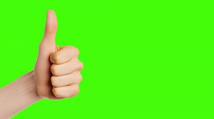 Hand giving a great thumbs up on green screen background