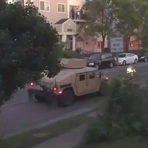 A Minneapolis woman who was recording a group of militarized cops patrolling her residential neighborhood in armored cars from her front porch ended up shot in the crotch with a paint canister for not stepping back in her house when ordered to do so. Read full story. https://newsmaven.io/pinacnews/cops-gone-rogue/watch-militarized-cops-shoot-paint-canister-at-woman-on-front-porch-1FM9C4yom0O-ABsP-3IG-A | PINAC News