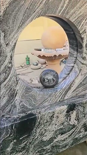 Mesmerizing Granite Fountain: A Rotating Ring with Captivating Central Sphere in Motion