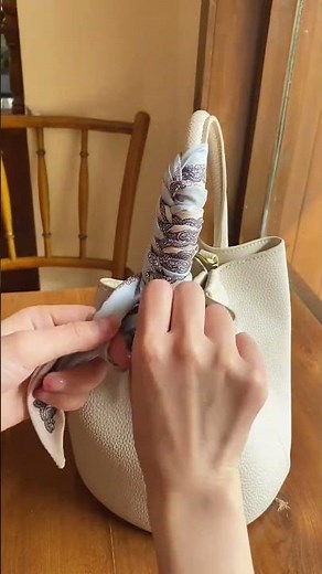 The Simplest Way to Wrap a Scarf Around Your Purse