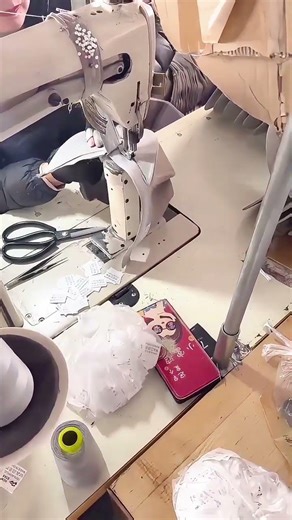 Sewing the brim onto a baseball cap.🏭🧢👷 #outfit #sewing #design #hat #factory