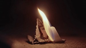 clip-3433599817-paper-consumed-by-fire-4k-shot