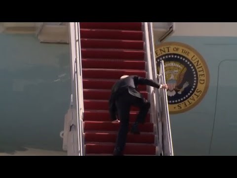 President Biden stumbles up stairs
