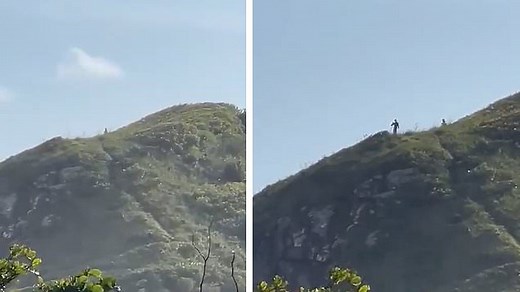 Two terrifying 10ft tall 'aliens' have been spotted on a hilltop