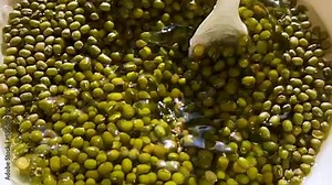 Cooking process of beans Mash or Bean asian cuisine sprouting beans Delicious healthy vegetarian food Sprouts sprouted and cooked cooking asian food Grains are poured into a plate.