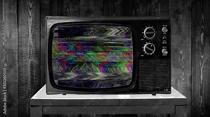 Zoom in then fixed shot on GLITCH TV static, spectral color reflection, retro