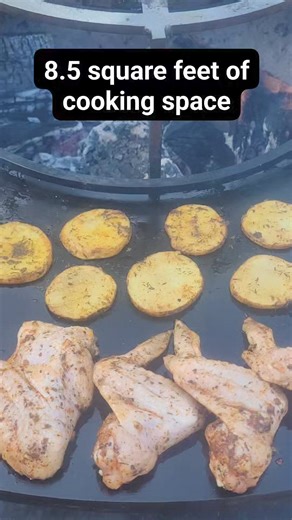 Imagine all the things you can cook with 8.5 square feet of cooking space on the Pyro Kitchen Griddle Fire Pit. Here, we have about 40 chicken wings, 2 fish filets, 1 sliced zucchini, half of a sliced pineapple, and a couple potatoes. #cookingwithwood #campfirecooking #campfirefood #firepit #cottagetimes #backyardliving #outdoorcooking | Pyro Kitchen