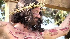 Man Poses As Crucified Christ on Cross for Easter