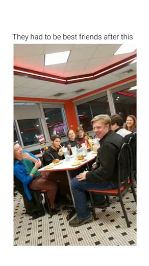 @findoldgreatestsong1 on Instagram: "This video captures a social interaction involving a comedic visual contrast and a prepared punchline within a public dining setting. The Subject A group of young adults is seated at a restaurant table. The primary focus is a man dressed in a full-body hot dog costume, positioned to create a juxtaposition between a person and the food item they are mimicking. The Mechanism The humor utilizes irony and a subversion of expectations. While another individual eat