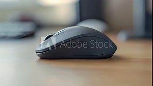 A side view of a compact wireless mouse featuring a tiny USB receiver for seamless connection.