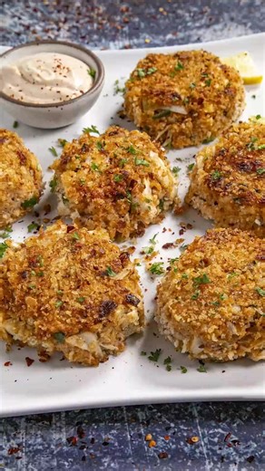 Crab Cakes Recipe with Creamy Crab Cake Sauce🦀 >> Comment “RECIPE" and I'll send this recipe straight to your DMs! 🥳 GET THE FULL RECIPE ⬇️ https://www.chilipeppermadness.com/recipes/crab-cakes/ Ingredients: 1 cup panko breadcrumbs divided (or use bread crumbs or crushed saltine crackers) 2 teaspoons Cajun seasoning or more to taste 1 tsp garlic powder Salt and pepper to taste 2 eggs beaten 1/4 cup mayonnaise (I prefer Duke's) 1 tablespoon of your favorite hot sauce 1 tablespoon whole grain mu
