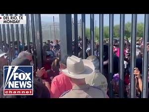 Fox News captures 'shocking' footage of migrants forcing way past border