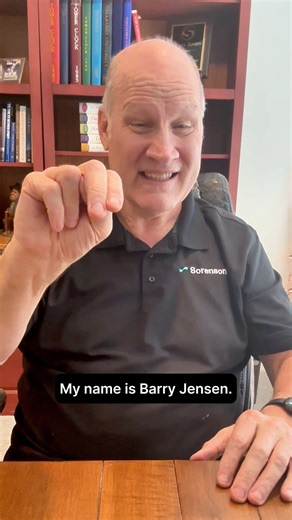 Meet Barry! He’s DeafBlind and has been part of the Sorenson family for 20 years. VD: A bald man sitting with brown desk infront of him, wearing a black polo shirt with Sorenson logo. There are two book shelves in the background with several books, awards, and objects on it. Transcript: Hello! My name is Barry Jensen. I’m DeafBlind, and I’ve been with Sorenson for 20 years. Sorenson is a great company because they truly value me as an employee and understand my needs. For example, during meeting