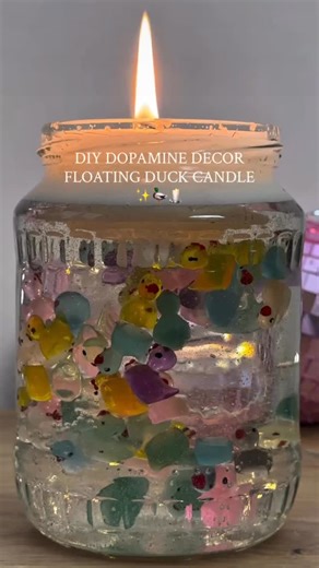 Frangenanc on Instagram: "DIY floating duck candle💫 This DIY adds the perfect pop of joy to your home and watching the wax melt is so satisfying. It’s a hybrid mix: The wax holds the wick and the clear hand soap keeps the ducks floating! Here is what you need to make your own floating rubber duck candle: A clear glass jar Clear liquid hand soap Mini rubber ducks Candle wax Candle wick"