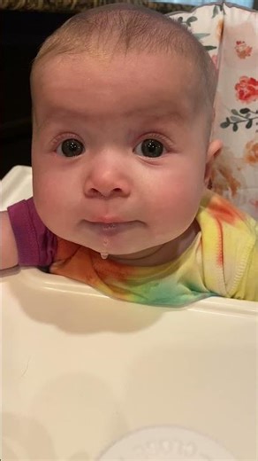 Baby’s first time eating in high chair