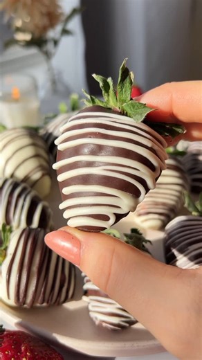 Gabriela Dimova on Instagram: "✨🍓Chocolate Covered Strawberries🍓✨ These chocolate-covered strawberries are so easy to make & so much cheaper and more delicious than store-bought!💞 ✨Ingredients 12 large fresh strawberries 1 cup vegan dark chocolate chips 1 cup vegan white chocolate chips ✨Tools toothpicks paper towel piping bag (optional) ✨Directions Start by washing and drying the strawberries. Leave them on a paper towel to dry for 20-30 min, then pat dry with a paper towel. Stick two toothp
