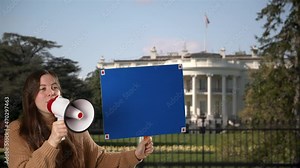 A woman holds a blank green screen sign and talks into megaphone for protest outside White House in Washington, DC. Tracking points for custom sign message.