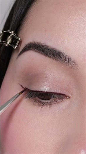 Thin winged eyeliner using Stila stay all day inkwear liner in cherry noir