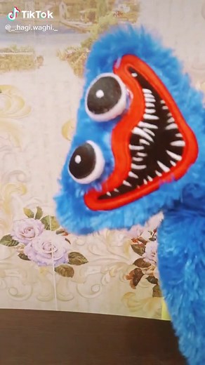 Animated Blue Puppet Dance on Floral Background