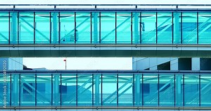 Nurse going to visit patients at hospital glass hallway during coronavirus COVID-19 pandemic outbreak in Los Angeles California, 4K