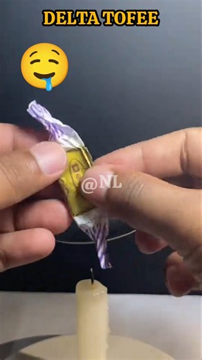 Melting delta toffe over a candle 😱 #shorts #viral #trending #candle #melting
