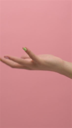 Woman having fun when throwing and catching black slime - Free Stock Video