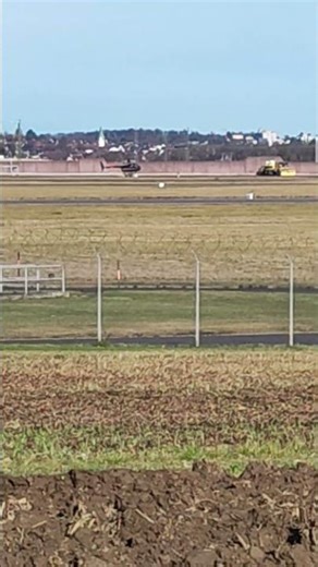 helicopter in training over taxiway