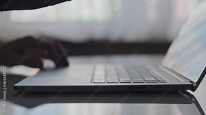Close-up of man hands typing on laptop keyboard. Businessman writing business letter. Man closing laptop with one hand. 4K, UHD