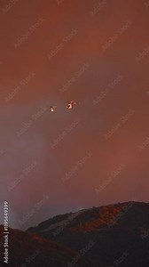 In LA, helicopters are battling a major fire in Malibu and Pacific Palisades. Stunning slowmotion 4K footage showcases the scale of firefighting efforts against natures fury