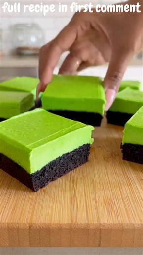 No-Bake 3-Ingredient Grinch Cool Whip Cheesecake Bars Grinchy Green Mint Oreo Cool Whip Cheesecake Bars with Whimsical Holiday Fun Recipe Ingredients: 24 mint sandwich cookies, finely crushed 8 oz cream cheese, softened 1 tub (8 oz) Cool Whip, thawed Directions: Line an 8x8-inch pan with parchment paper, leaving overhang for easy removal. Press half of the crushed mint sandwich cookies firmly into the bottom of the pan to form the crust. In a mixing bowl, beat the softened cream cheese until smo