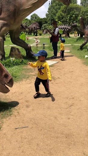 Exploring Realistic Dinosaur Models at a Park