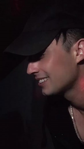 Engaging Dance Moves in Colorful Club Setting