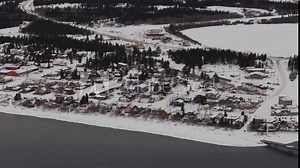 The Town of Carcross, Nestled on the Shores of Bennett Lake, is Blanketed in Snow During the Winter in the Yukon, Canada - Aerial Drone Shot