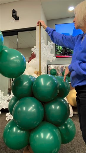 A balloon Christmas tree is really just a balloon column made of clusters of four in ascending sizes! Super easy and quick to assemble. #balloons #christmastree #ballooncolumn #holidayballoons #christmasballoons | Over the Moon Balloons
