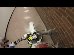 Riding dirt bike through school