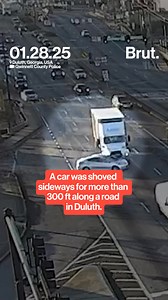 Police in Georgia have released video footage of a horrifying hit-and-run incident where a car was shoved sideways for over 328 feet along a road in Duluth by a tractor-trailer. The incident occurred on January 28 on Pleasant Hill Road, captured by Gwinnett County Police. The video shows the truck attempting to switch lanes before colliding with the car, pushing it through two intersections. Additional dashcam footage from inside the car captures the driver's terrifying ordeal. "Oh my God," can 