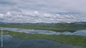 view of the andes mountain range surrounded by lagoons in the peruvian highlands