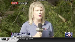 Albino squirrel checks out Kristyn Allen's live report on the downed trees in Kewaunee. The squirrel appeared to have pink eyes. | WBAY TV-2