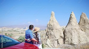 Happy couple on summer vacation in famous place. Cave formations.