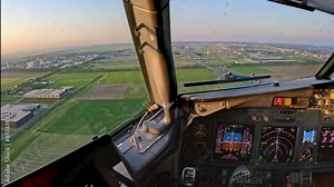 Landing seen forward view from cockpit of aircraft, airplane, jet plane from holiday destination and many instruments and controls on the flight deck Amsterdam airport Schiphol