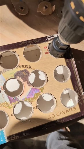 Here at our tiny Barn, we take sustainability seriously — even with Amazon and Etsy just a click away, luring us with convenience. Truth is, I couldn’t find a single display that fit the vibe or budget. So, I started makin’ 'em— beginning with one of the more beat-up vintage cigar boxes I picked up at an estate sale in Lockhart awhile back. Still waitin’ on the right-sized Dremel bit to fall in my lap, but hey — it’s comin’ together. Whadda ya think? Off to make another for our best-selling Lady